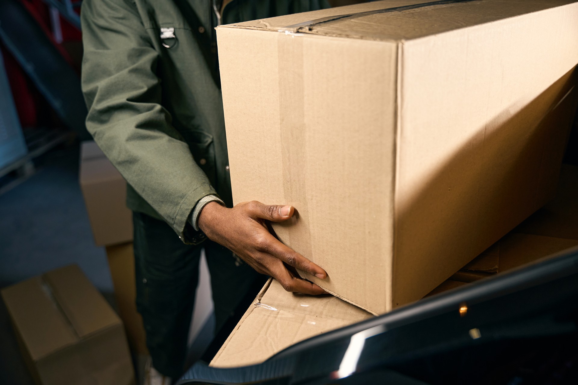 Man takes things out of a car in a storage service